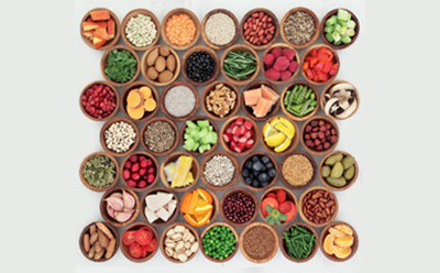 An array of colorful spices and ingredients, each housed in individual round bowls, neatly arranged An array of colorful spices and ingredients, each housed in individual round bowls, neatly arranged