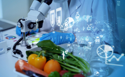 Vitamins The image depicts a scientist in a laboratory setting, meticulously examining fresh vegetables under a microscope.