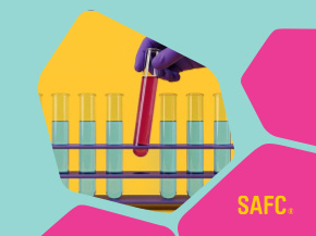Stylized illustration of a purple-gloved hand holding a red test tube above yellow laboratory tubes, with abstract pink and yellow shapes on a turquoise background and the “SAFC” logo in the lower right.