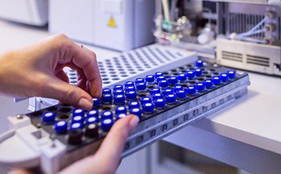 Analytical chemistry Scientist holding an HPLC chromatogram