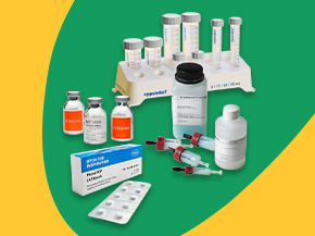Laboratory scene with a white tube rack holding several tall, clear tubes with blue measurement markings and gray caps, three Corning glass vials with bright orange labels, a nickel resin chromatography column kit from Cytiva, PhosSTOP product box with a blister pack of tablets shown beside it.