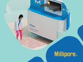 A laboratory technician in a white lab coat is operating a blue and white analytical instrument in a modern laboratory. The technician is positioned near a patterned mat on the floor, while the instrument appears to be designed for advanced analysis. In the lower right corner, there is a yellow banner with the text 'Millipore.'